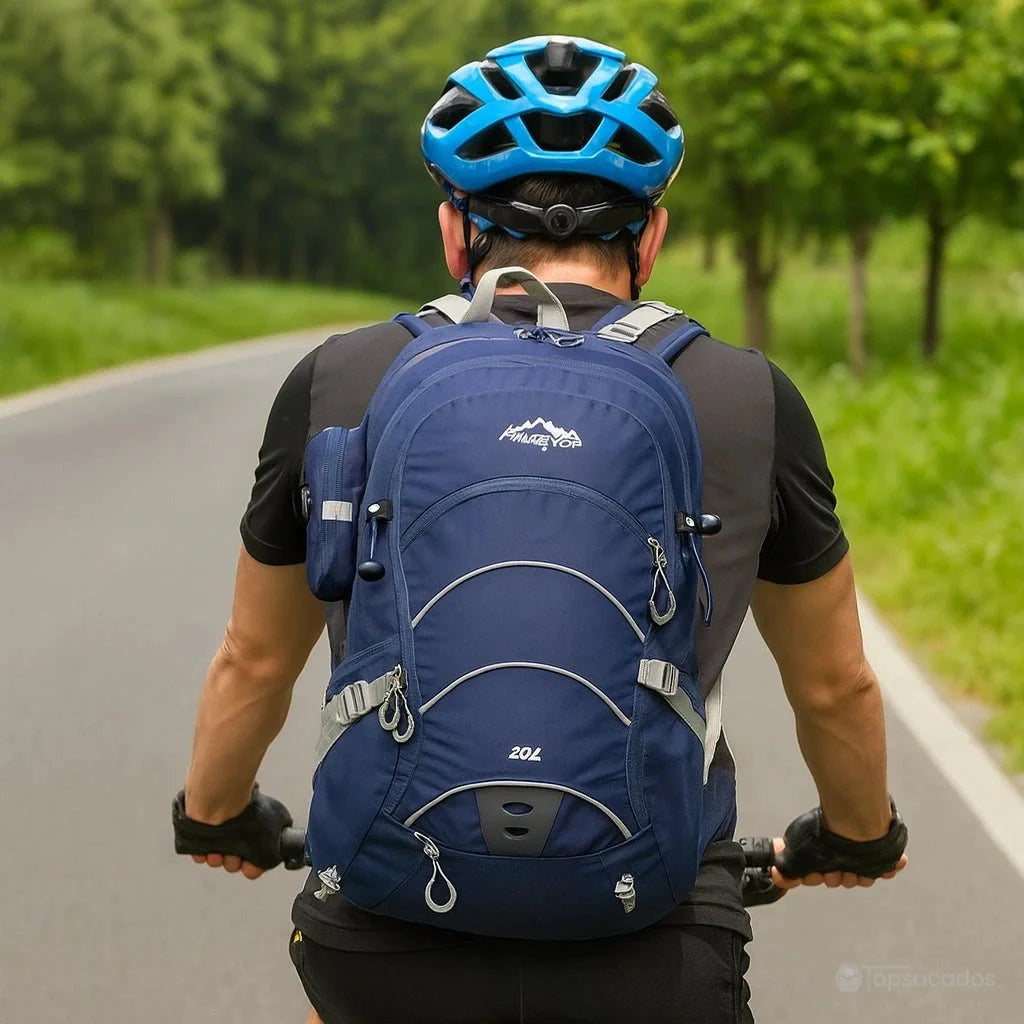 Sac à dos 20 L randonnée marine porté par cycliste sur route, adapté au vélo avec maintien optimal