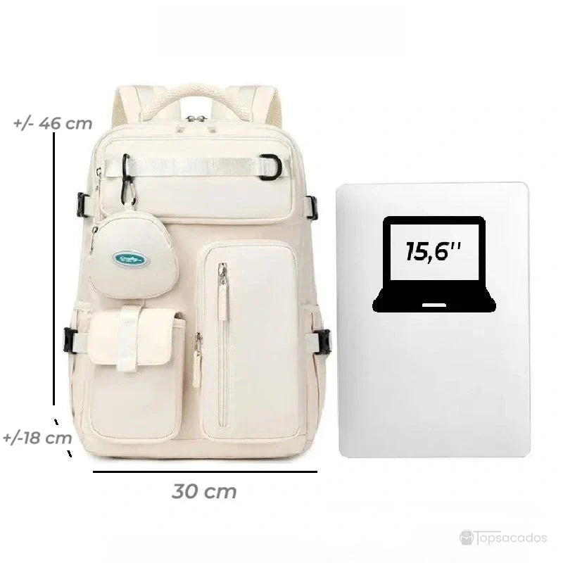 Sac à dos 25l crème présenté à côté d’un ordinateur 15,6 pouces, dimensions visibles pour évaluer la compatibilité