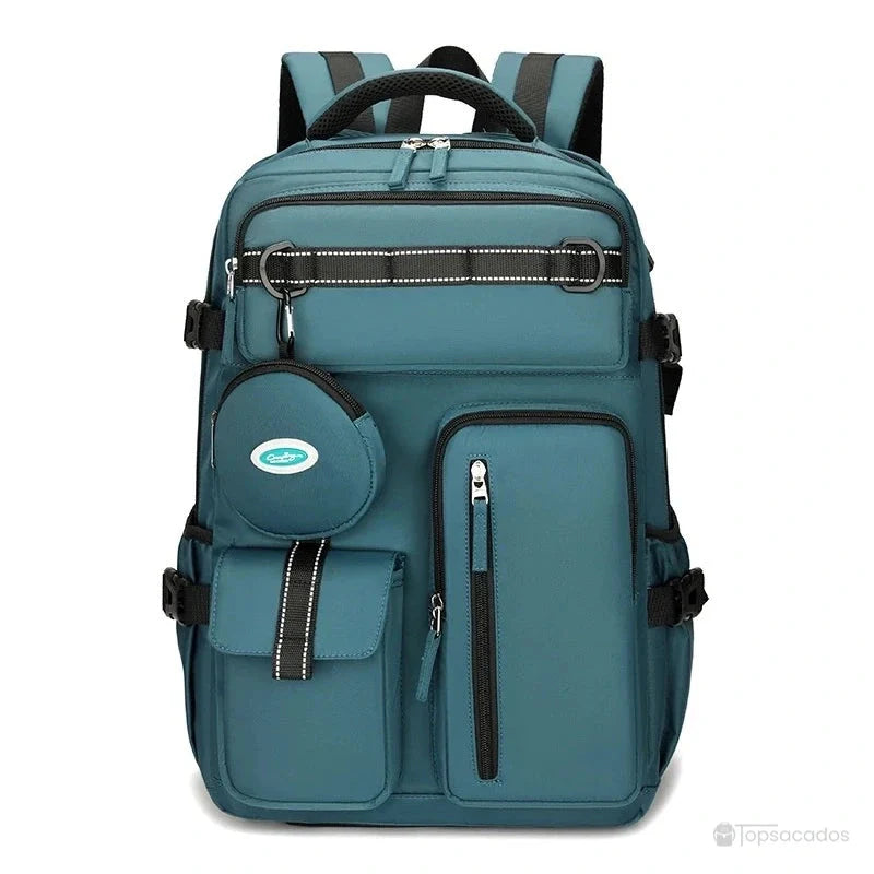 Sac à dos 25l bleu paon de face avec fermetures noires contrastantes et accessoires inclus, sur fond blanc