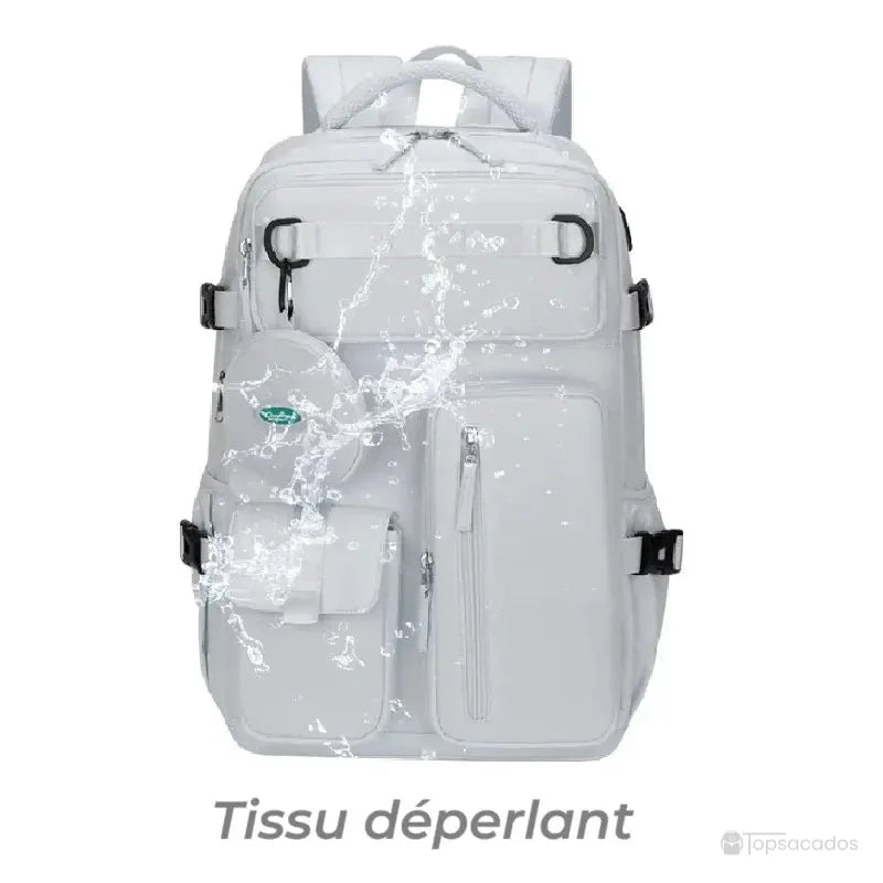 Sac à dos 25l blanc résistant à l’eau, présenté avec des éclaboussures pour illustrer le tissu déperlant
