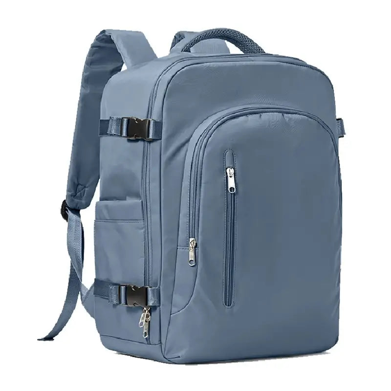 Sac à dos 30 litres bleu foncé avec sangles de maintien et poignée renforcée, posé sur fond blanc