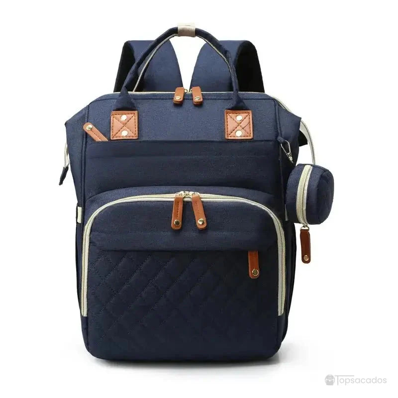 Sac à dos à langer avec port usb en tissu bleu marine, avec grande poche frontale zippée et ouverture supérieure rigide, sur fond blanc.
