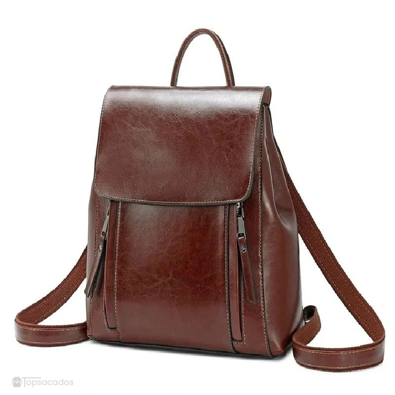 Sac à dos antivol Femme cuir marron foncé élégant, avec deux poches frontales verticales et anses solides, en vue de face.