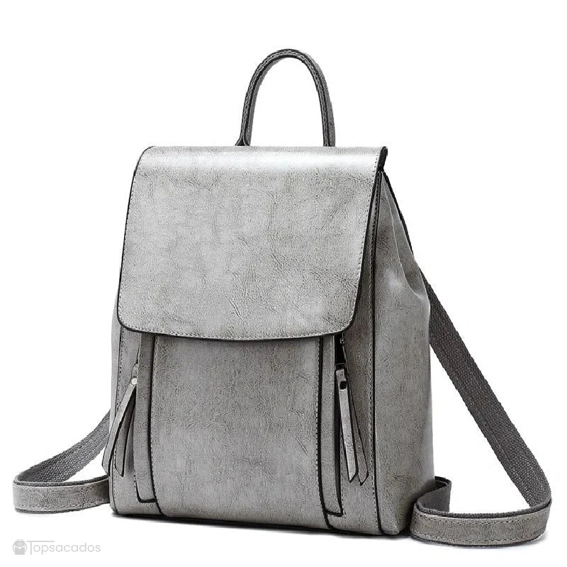 Sac à dos antivol Femme cuir gris moderne avec effet texturé, bretelles larges et fermeture rabattable.