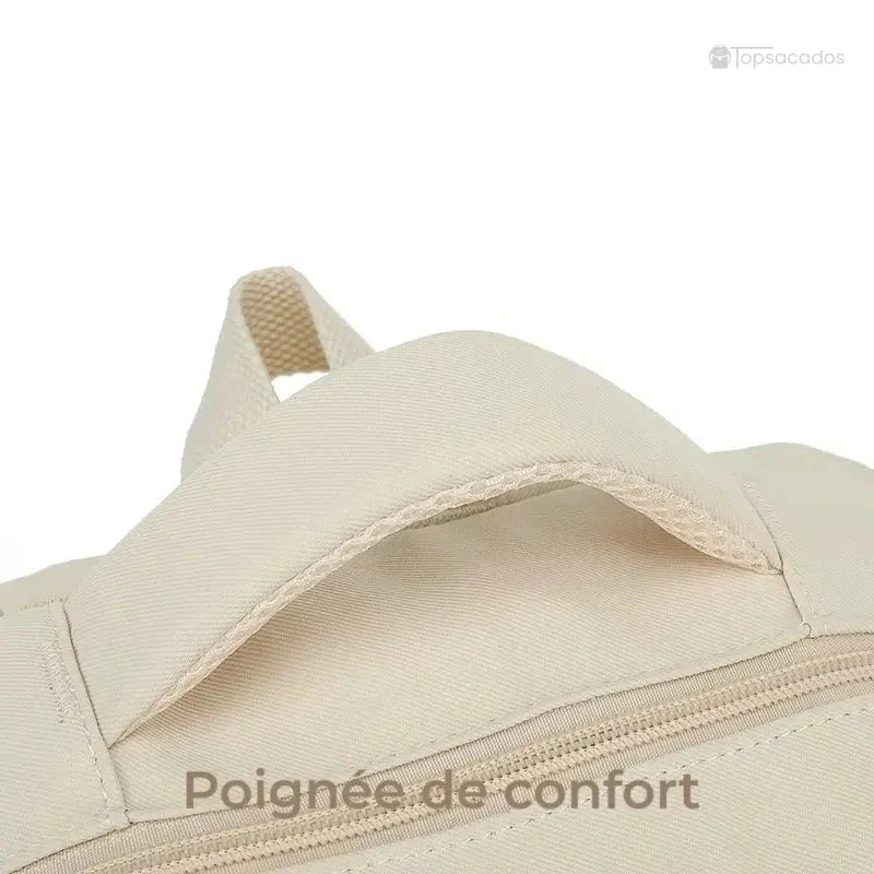 Sac à dos collège beige équipé d'une poignée rembourrée pour un port confortable à la main.