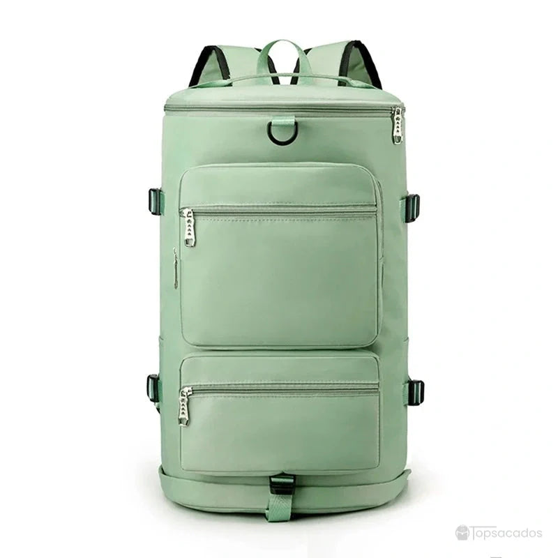 Sac à dos compartiment chaussure vert pastel avec fermetures éclair argentées, présenté en position verticale