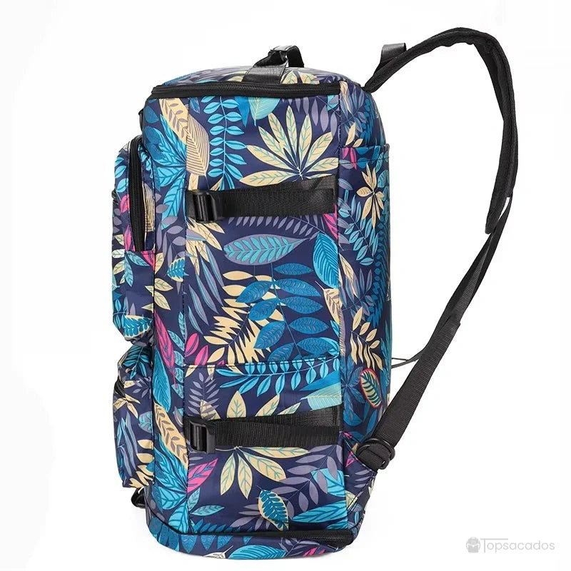 Sac à dos compartiment chaussure à motif feuillage vu de profil, mettant en évidence les sangles latérales et poches de rangement