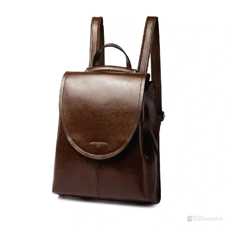 Sac à dos cuir femme marron foncé sur fond blanc, vue de face avec détails sobres et minimalistes.