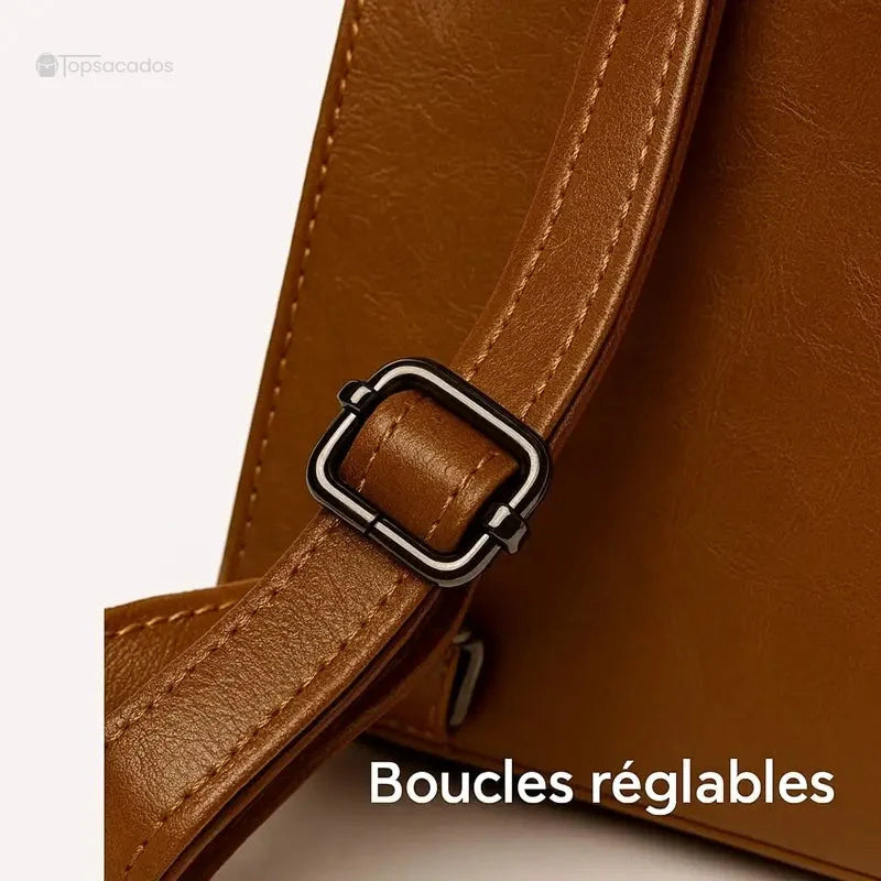 Sac à dos cuir femme marron avec boucle de sangle réglable noire, gros plan sur la finition de lanière.