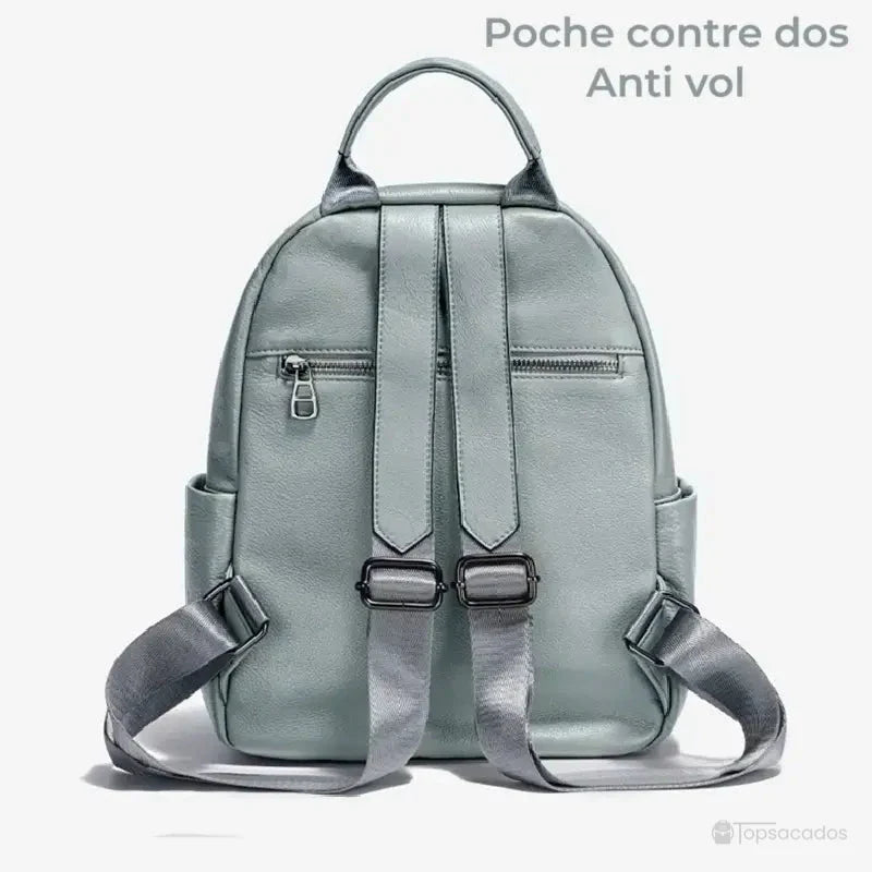 Sac à dos cuir femme vert clair vu de dos, montrant les bretelles ajustables et une poche antivol zippée discrète au centre.