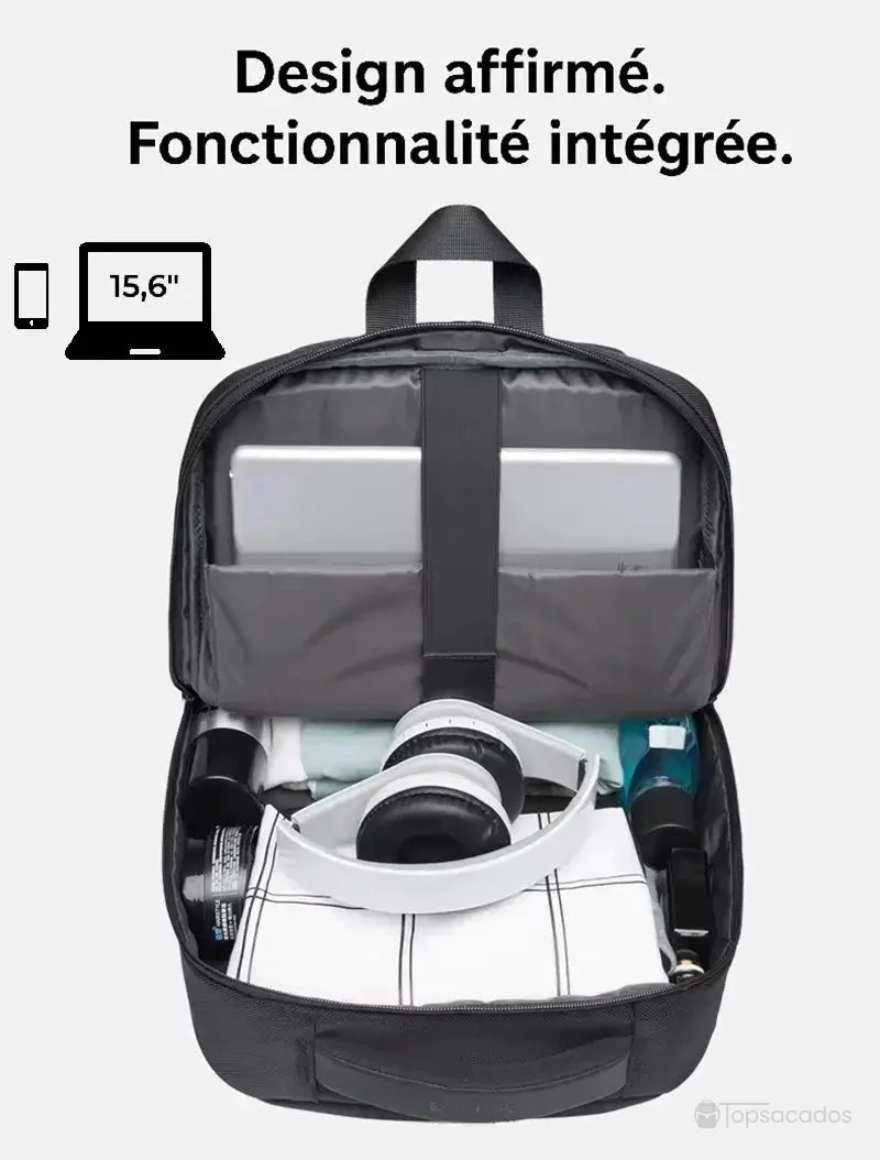 Sac à dos de cours ouvert contenant ordinateur portable, casque audio et vêtements, compartiment spacieux bien organisé