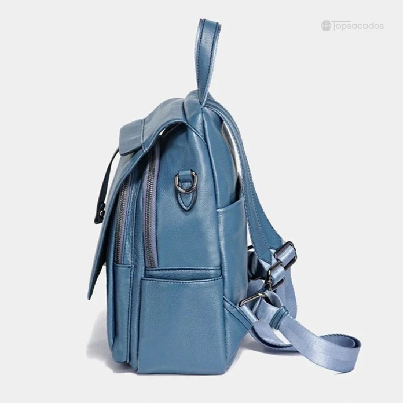Sac à dos femme élégant bleu clair vu de profil montrant les poches zippées et la finition cuir