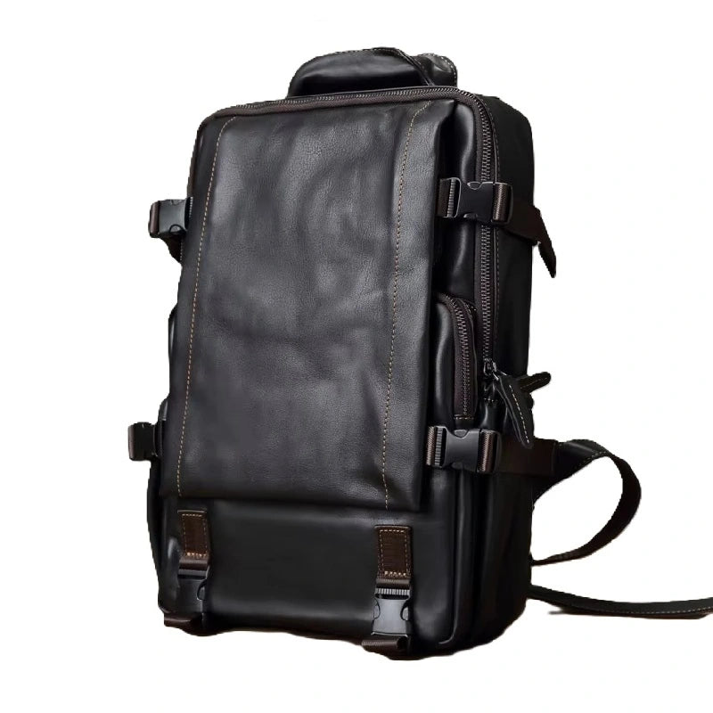 Sac à dos homme cuir noir rectangulaire avec coutures beiges visibles, photographié sur fond blanc épuré.