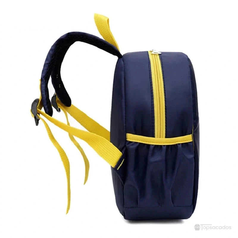 Sac à dos maternelle dinosaure bleu marine vu de profil avec fermeture éclair jaune et bretelles larges ajustables