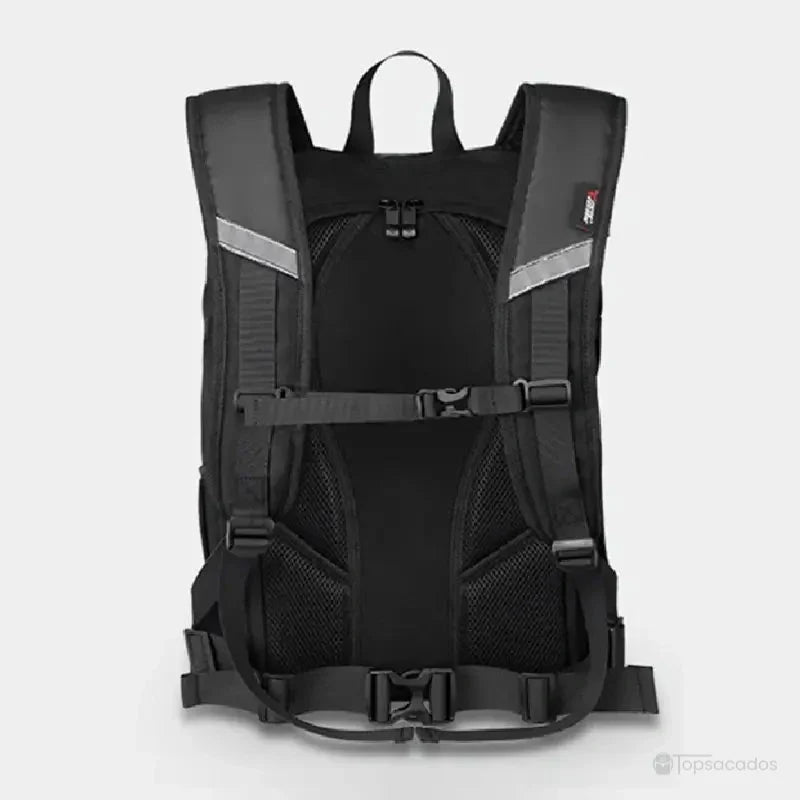 Sac à dos moto étanche vu de dos, posé à plat sur fond clair, avec sangles réglables, bretelles rembourrées et ceinture ventrale bien visibles.