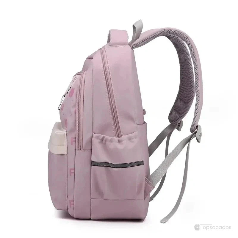 Sac à dos primaire fille vu de profil gauche, montrant la poche latérale et les bretelles ergonomiques.