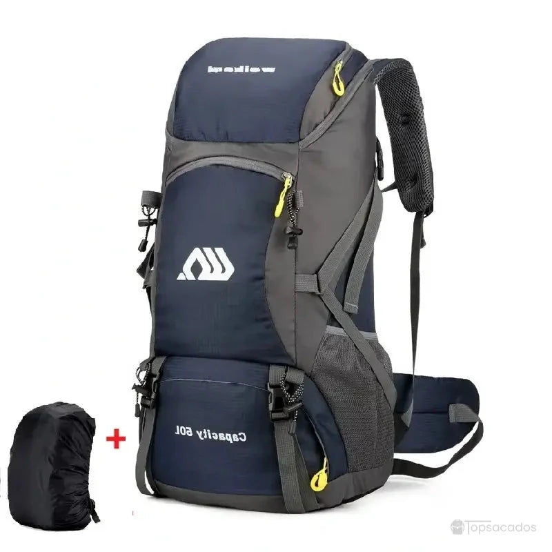 Sac à dos randonnée 50 litres bleu marine avec détails jaunes, posé debout sur fond blanc, accompagné d'une housse de protection noire.