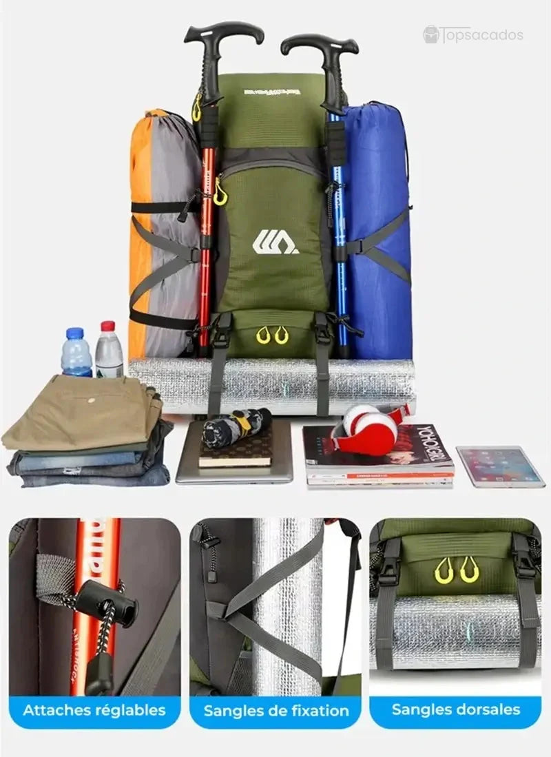 Sac à dos randonnée 50 litres vert chargé d'équipements, avec matelas, bâtons de marche, vêtements et accessoires exposés sur fond clair.