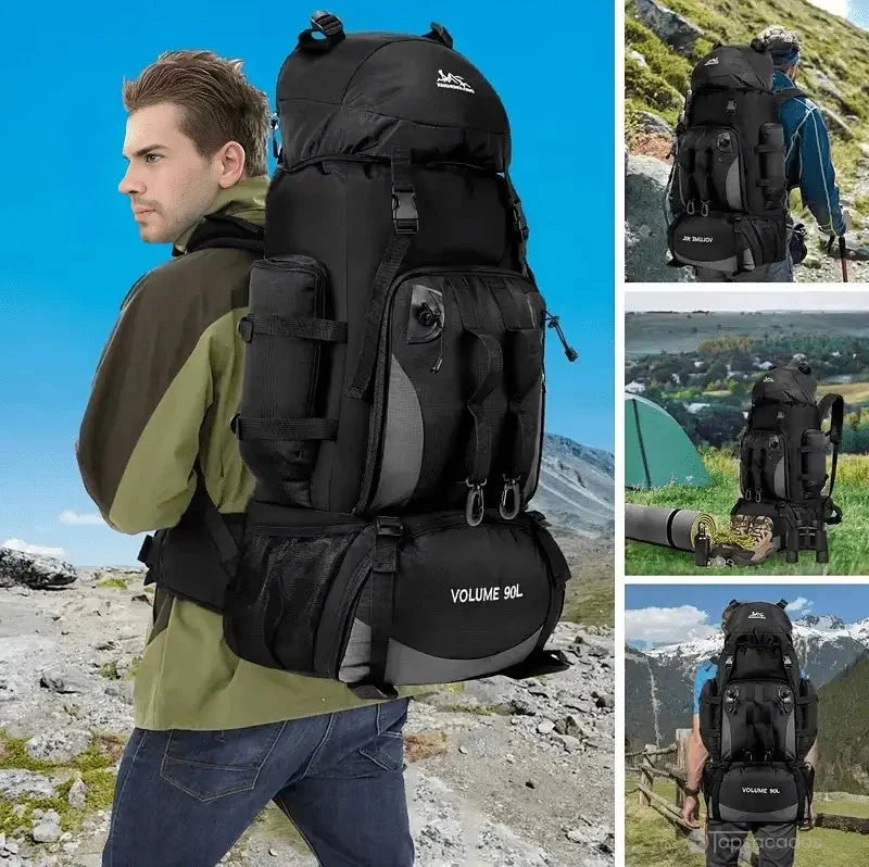 Sac à dos randonnée noir porté par un randonneur en montagne, montrant sa grande capacité et sa solidité en terrain difficile.