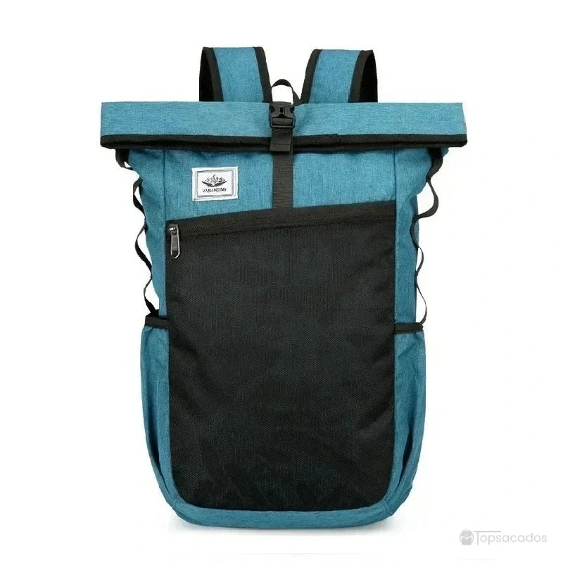 Sac à dos roulé vert turquoise avec grande poche noire à fermeture éclair et boucle centrale, présenté de face sur fond blanc.