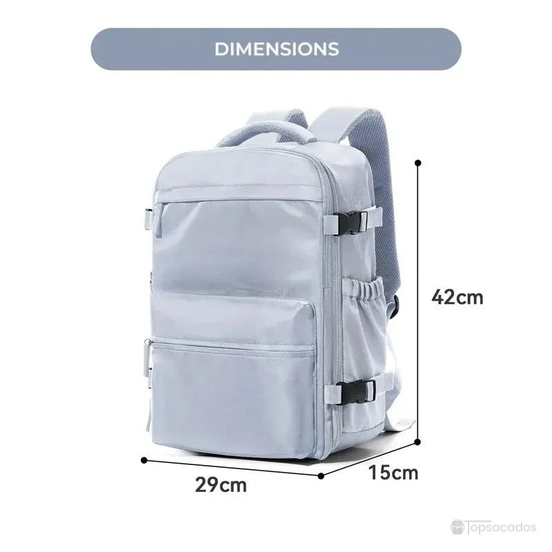 Sac à dos sous vide gris clair avec indication précise des dimensions hauteur 42 cm, largeur 29 cm et profondeur 15 cm, sur fond blanc.