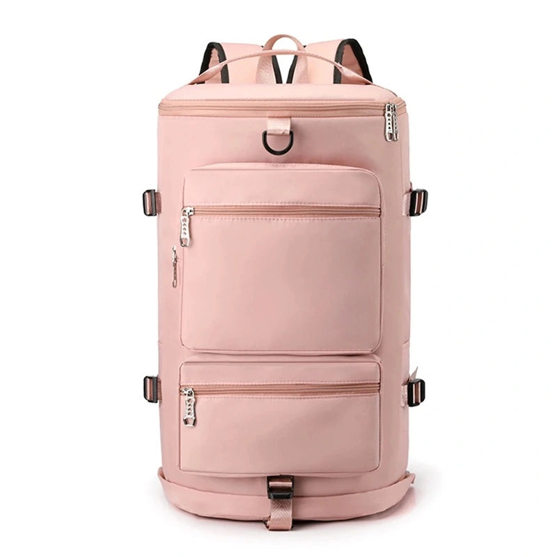 Sac à dos sport grand volume rose clair présenté de face, avec deux grandes poches zippées et anneau d’attache en haut.