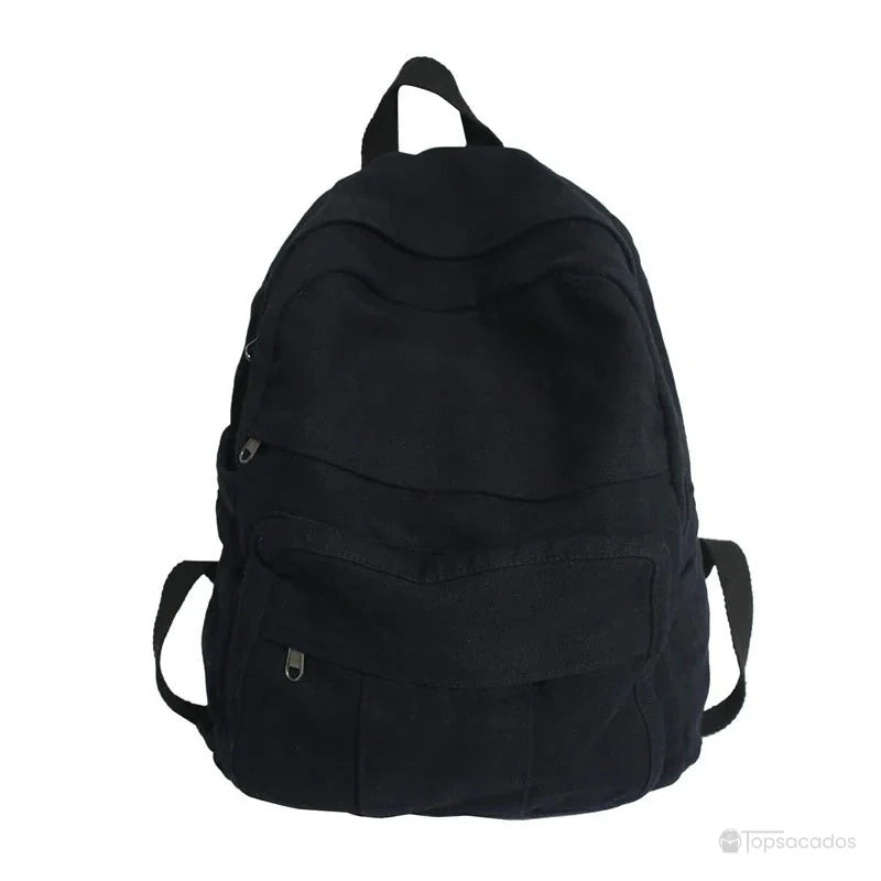Sac à dos toile noir uni vu de face, avec plusieurs poches zippées, sur fond blanc