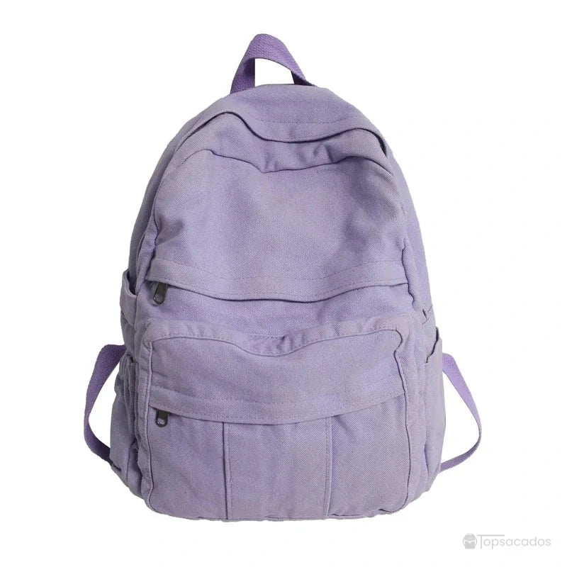 Sac à dos toile violet clair vu de face avec grandes poches zippées sur fond blanc