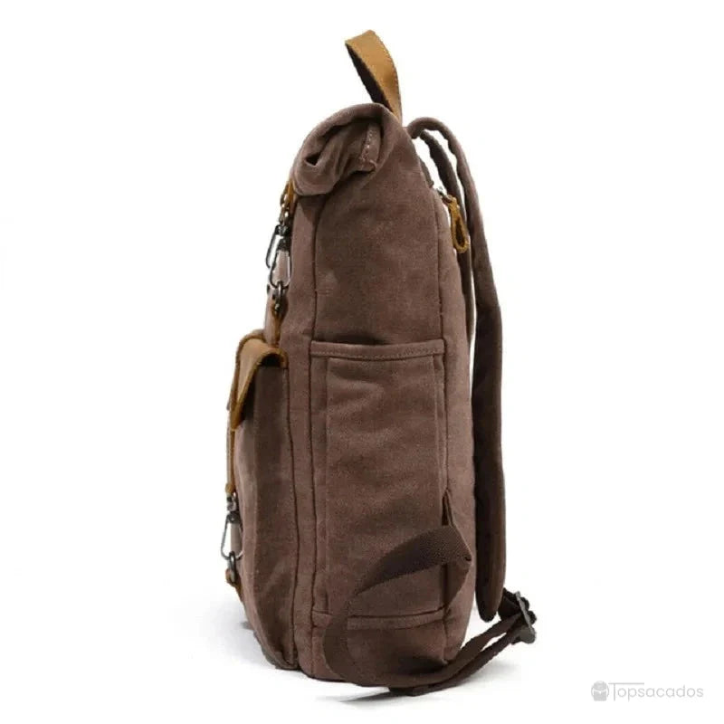 Sac à dos toile Rolltop vu de profil, avec poches latérales pratiques et sangle en cuir, parfait pour un usage quotidien.