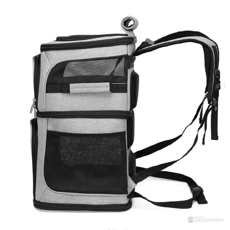 Sac à dos transport chat duo - vue de profil gauche avec bretelles, poches latérales et aérations visibles.