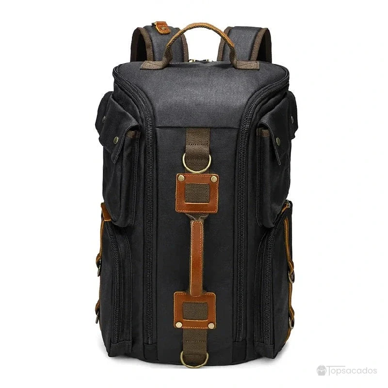 Sac à dos vintage noir avec sangles décoratives en cuir, affiché de face sur fond neutre