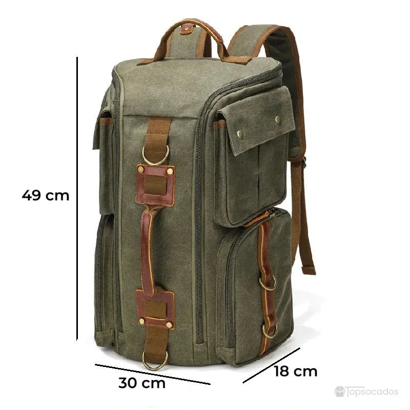 Sac à dos vintage vert kaki avec dimensions indiquées, poches latérales visibles et détails en cuir