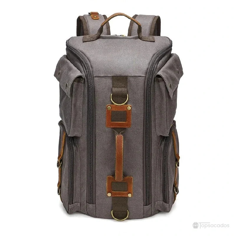 Sac à dos vintage gris en toile avec sangles contrastantes en cuir, présenté de face