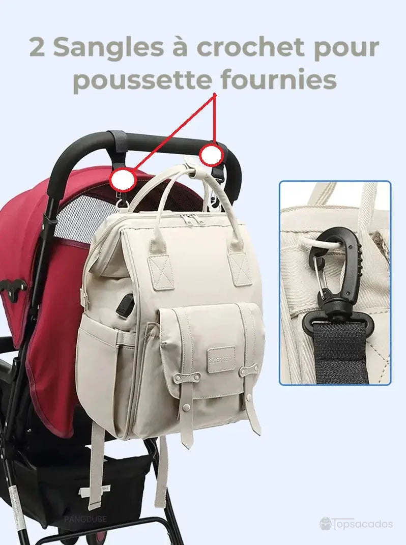 Sac à langer à dos suspendu à une poussette grâce aux sangles à crochet fournies.