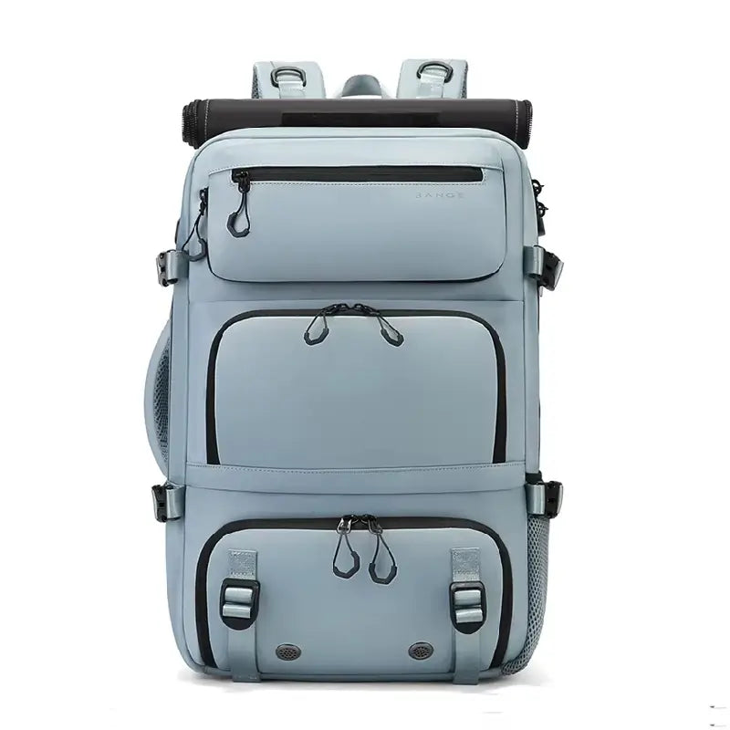 Sac à dos 30L bleu clair présenté en vue de face, équipé de plusieurs poches avant zippées, sangles de compression et détails en maille latérale.