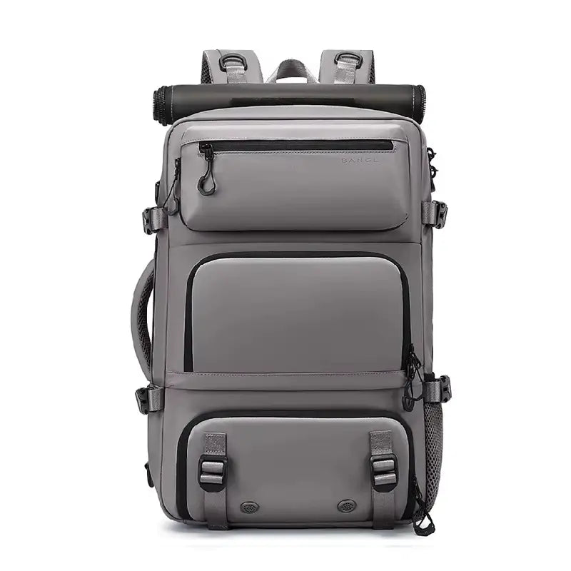 Sac à dos 30L gris avec trois poches frontales zippées, design épuré et structure renforcée, présenté de face sur fond blanc.