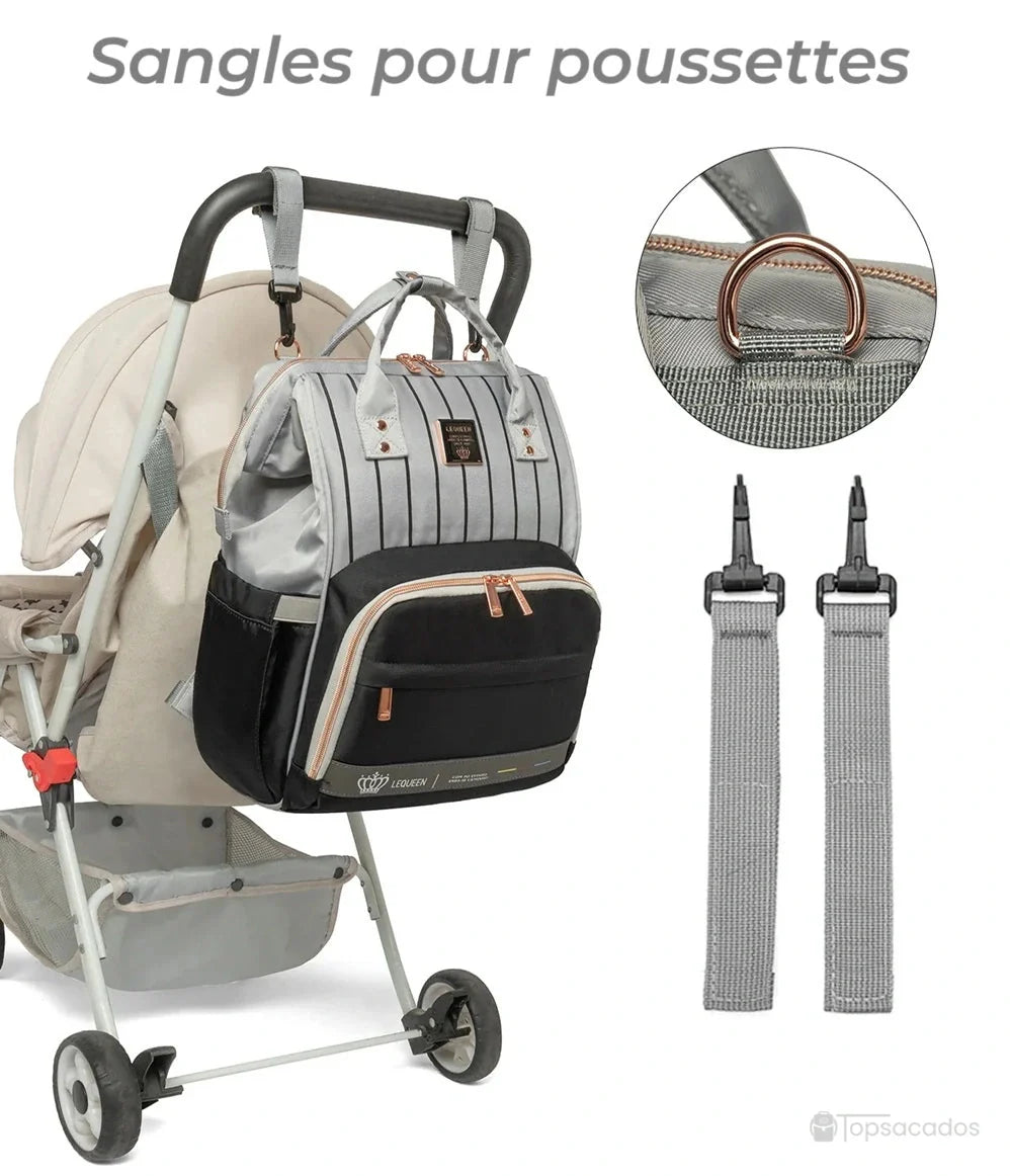 Sac à dos à langer Urbain et chic fixé à une poussette grâce à ses sangles spécifiques, idéal pour les déplacements en ville.