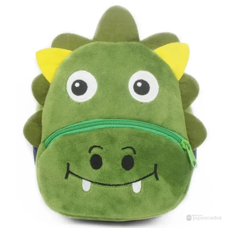 Sac à dos Bébé vert en peluche représentant un dinosaure souriant, avec crêtes jaunes et fermeture éclair verte.