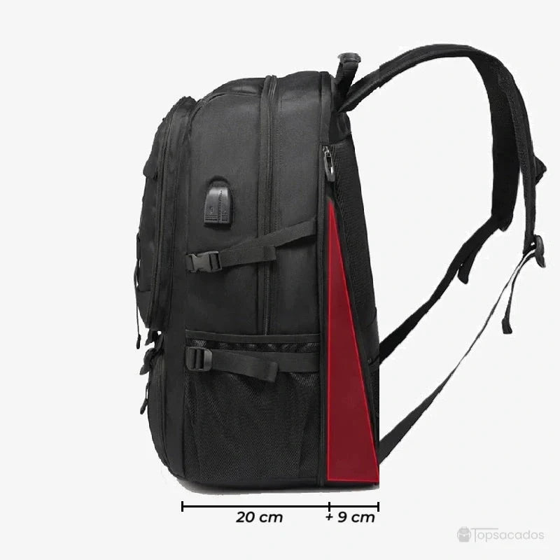 Sac à dos compartiment chaussure extensible vu de profil avec extension latérale rouge illustrant l'augmentation du volume de rangement