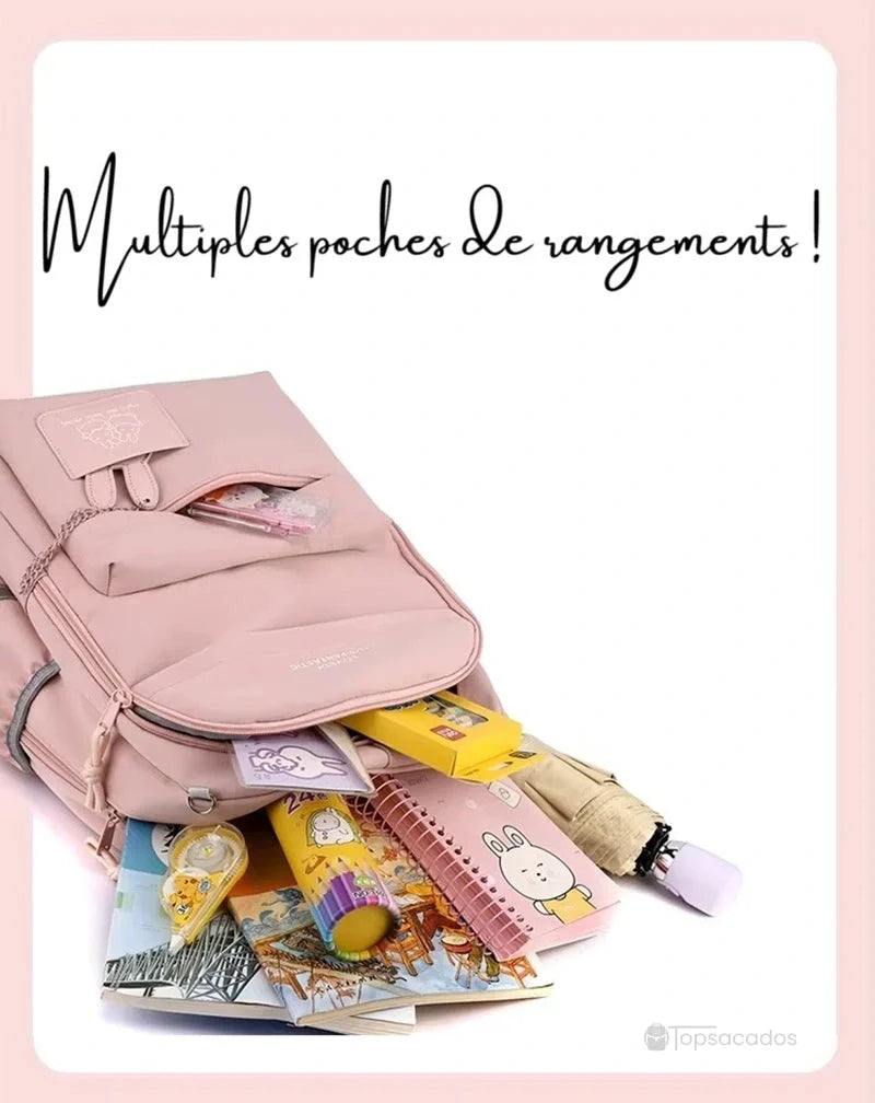 Sac à dos école ouvert avec fournitures scolaires visibles, cahiers, stylos et parapluie sortant.