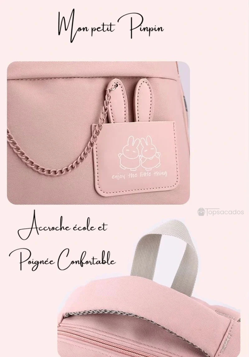 Sac à dos école rose avec décoration lapin et poignée de transport confortable vue rapprochée.