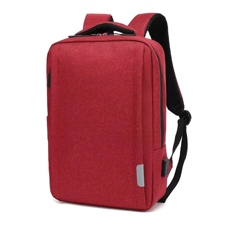 Sac à dos ordinateur Homme rouge uni, présenté de trois quarts sur fond blanc, avec port USB intégré.