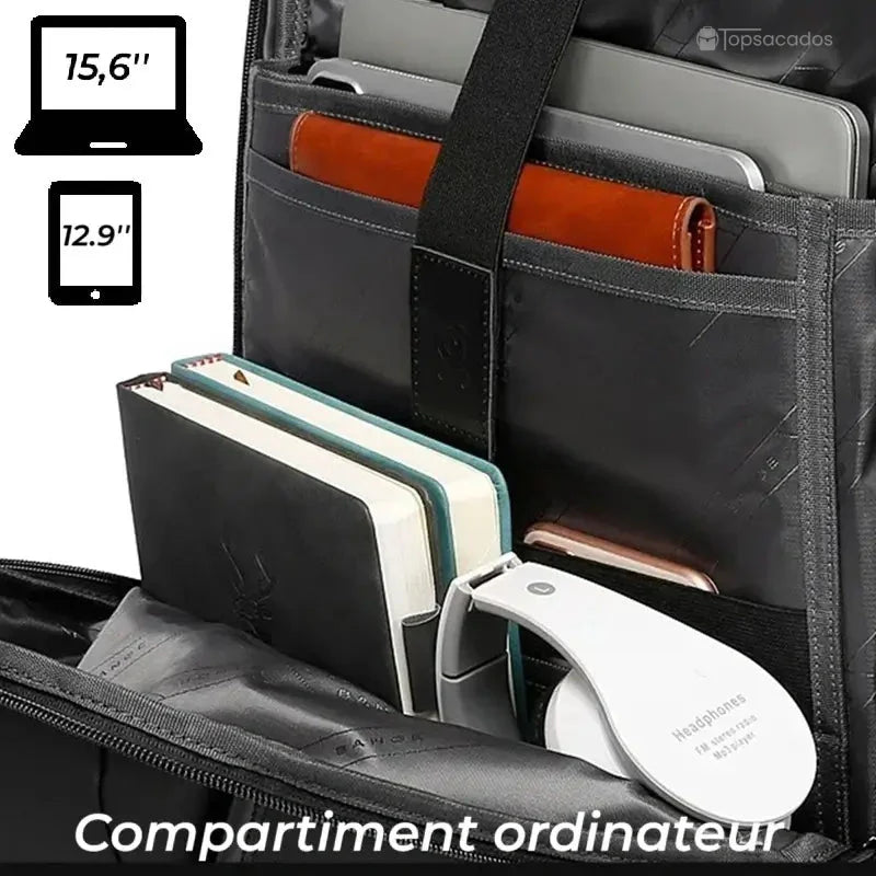 Sac à dos ordinateur portable design avec compartiment intérieur ouvert, montrant des rangements pour ordinateur 15,6 pouces, tablette, carnets et casque audio.