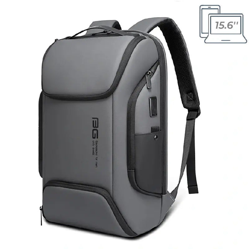 Sac a dos ordinateur portable multipoches gris avec détails noirs, design ergonomique avec port USB intégré, photographié sur fond neutre.