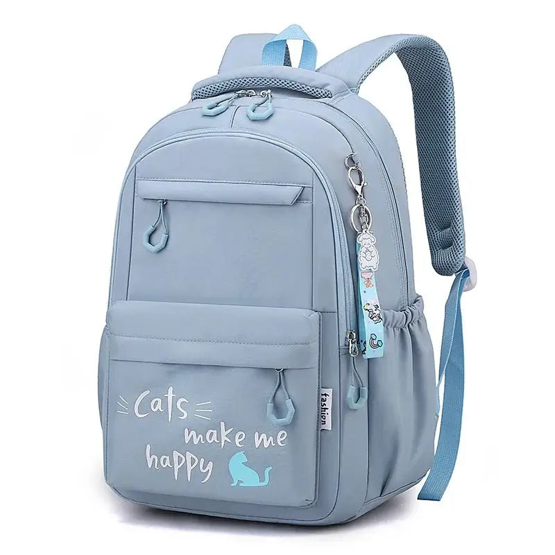 sac a dos primaire bleu ciel avec message 'cats make me happy', conçu pour enfants, vu de face en studio