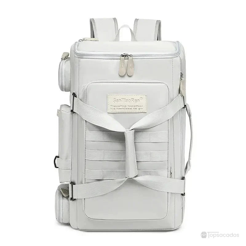 Sac à dos sport blanc avec sangles croisées, poches latérales et design structuré, idéal pour le sport et le quotidien.