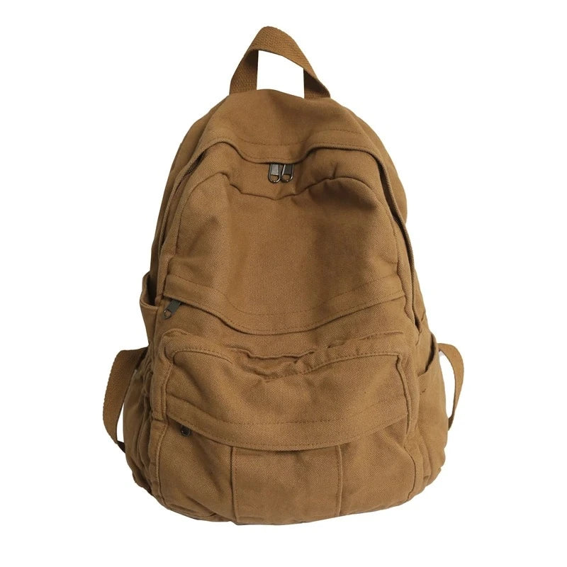 Sac à dos toile marron vu de face, avec poches multiples zippées et poignée supérieure