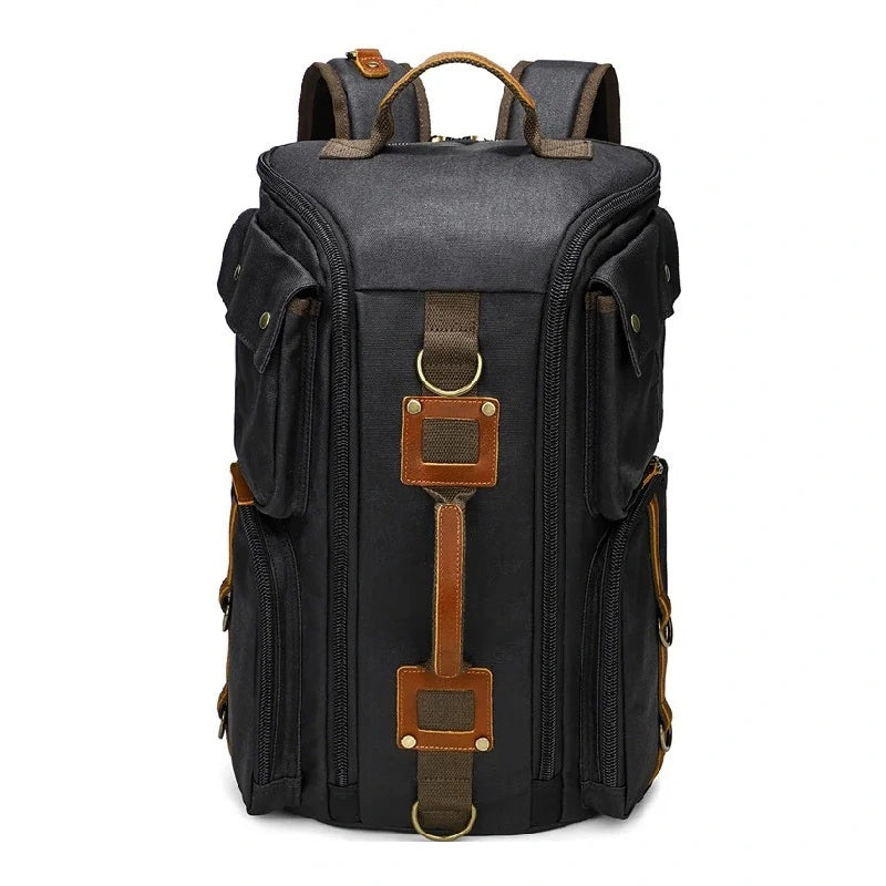 Sac à dos vintage noir avec sangles décoratives en cuir, affiché de face sur fond neutre