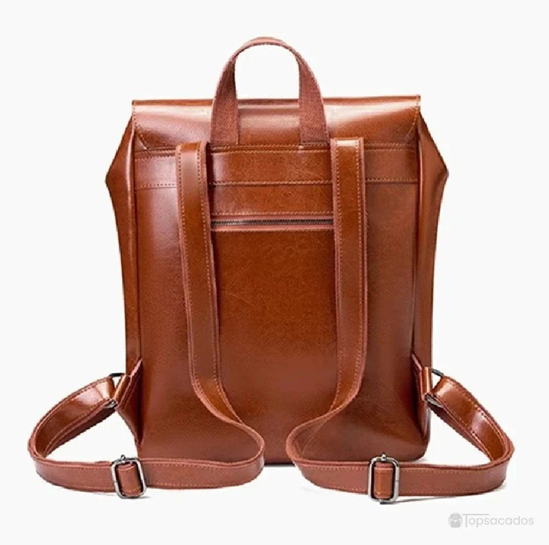 Sac à dos vintage pour femme vu de dos, montrant les bretelles marron réglables et une poche arrière discrète sur fond blanc.